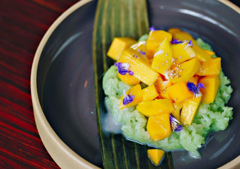 Mango Sticky Rice · Sweet sticky rice served with mango and topped with coconut cream.