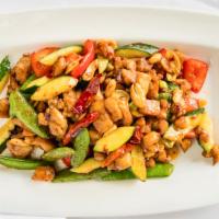 Kung Po Chicken · Spicy. Dark meat chicken with snap peas, zucchini, bell peppers, and peanuts in chef’s speci...