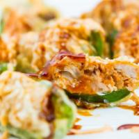 Blow the Whistle · Deep fried jalapeño stuffed with cream cheese and spicy tuna, topped with chef's special sau...