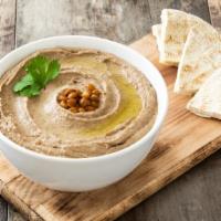 Hummus with Pita Bread · Fresh hummus dip served with pita bread.