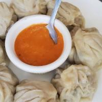 Chicken Jhol Momo · Eight pieces. Chicken momo served with spicy homemade momo soup.