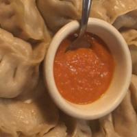 Vegetable Jhol Momo · Eight pieces. Vegetable momo served with spicy homemade momo soup.