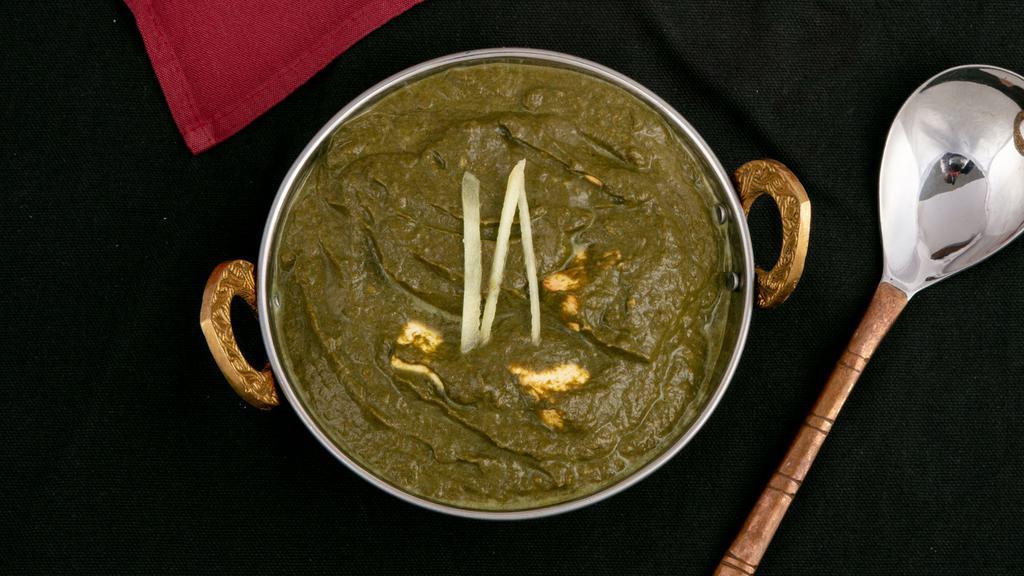 Palak Paneer · Gluten free. Minced spinach with fried cheese cubes cooked in a creamy sauce special herb and spices.