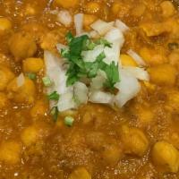21. Chana Masala( Vegan) · Vegan. Garbanzo beans cooked with special herb and spices in the house special sauce.