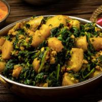 17. Potato Spinach( vegan) · Vegan. Fresh spinach with potato cooked in a tomato sauce with nepali special herb and spices.