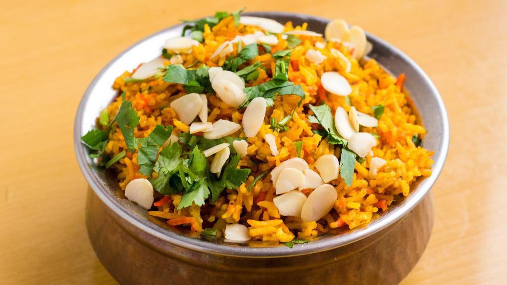 Lamb Biryani · Gluten free. Premium boneless lamb cubes cooked with basmati rice in a special meat biryani masala and topped with almond and cashew.