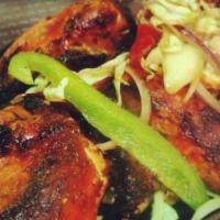 Lamb Tandoori Boti Kabab · Tender lamb marinated in yogurt and spices, broiled in the tandoor oven. Served sizzling wit...