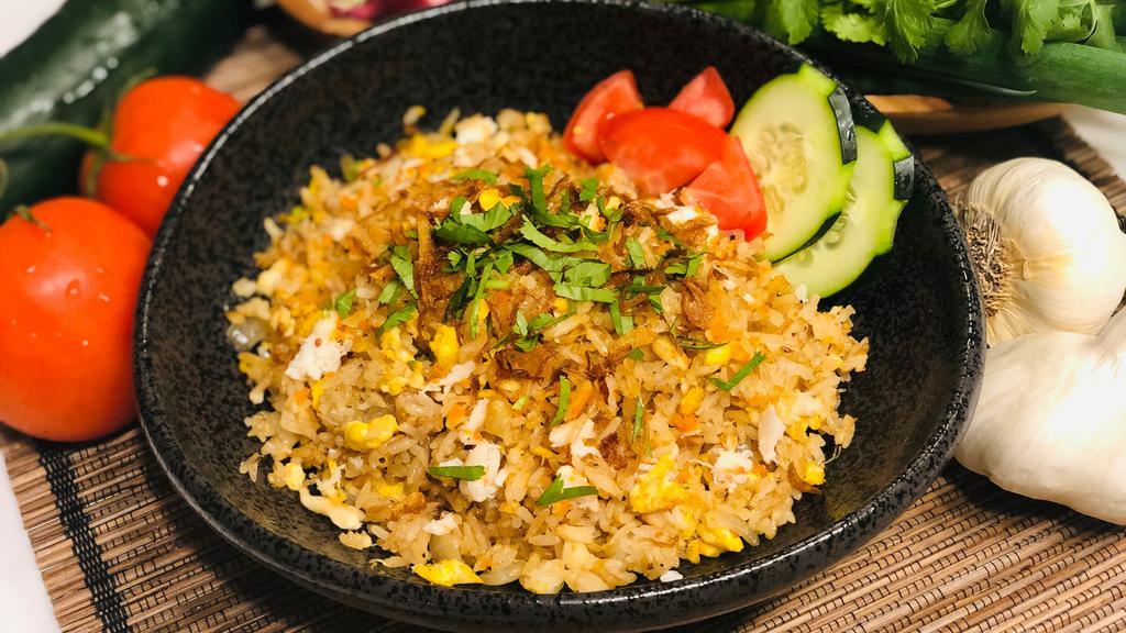 Crab Fried Rice Bowl · Mild to medium spicy. Fried rice, real crab meat, scrambled egg, yellow onion, garlic, fried shallots, black pepper, and cilantro.