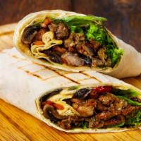 Spicy Chorizo (Smoked Pork Sausage) Breakfast Burrito · A mouthwatering spicy Breakfast burrito made with Flour tortilla and filled with scrambled e...