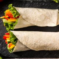 Spicy Veggie Breakfast Burrito · A mouthwatering spicy Breakfast burrito made with Flour tortilla and filled with scrambled e...