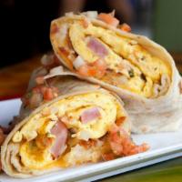 Ham Breakfast Burrito · A mouthwatering Breakfast burrito made with Flour tortilla and filled with scrambled eggs, h...