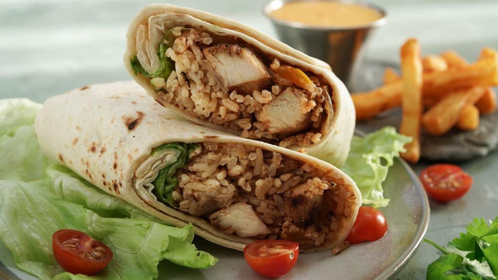 Super Chicken Burrito · A mouthwatering Super Burrito made with a Flour tortilla and filled with chicken, rice, beans, salsa, avocado, sour cream, and cheese.