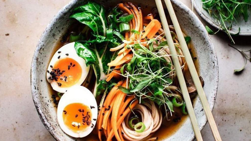 Vegetable Ramen Soup · Perfectly spiced noodles soup, made with mixed vegetables, green onions, seaweed, sesame seed, and a boiled egg.