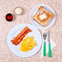 French Toast Combo · Two scrambled eggs, two slices of French toast, syrup, and your choice of protein.