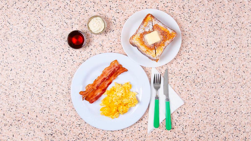 French Toast Combo · Two scrambled eggs, two slices of French toast, syrup, and your choice of protein.