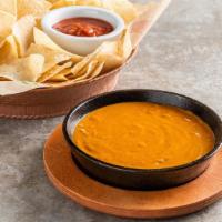 Skillet Queso · Your chip’s favorite dip for over 25 years. Original with beef. Served with chips & salsa.