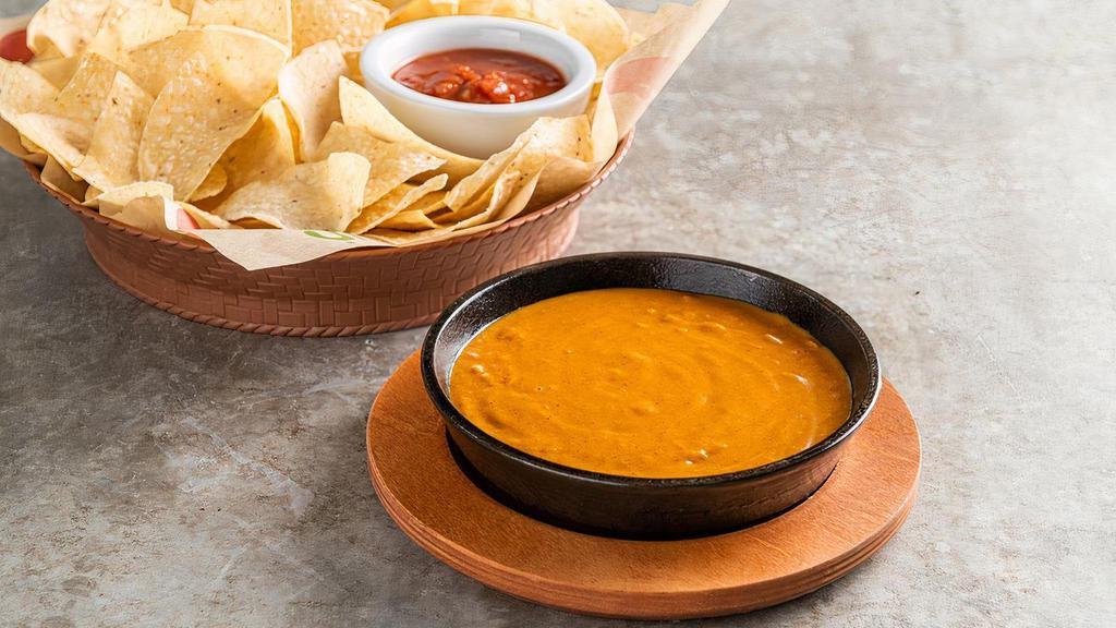 Skillet Queso · Your chip’s favorite dip for over 25 years. Original with beef. Served with chips & salsa.