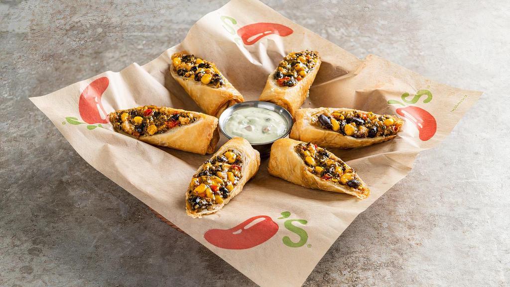 Southwestern Eggrolls · These aren’t your ordinary eggrolls. Crispy flour tortillas, chicken, black beans, corn, jalapeño Jack cheese, red peppers, spinach. Served with avocado-ranch.