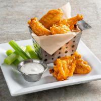 Bone-In Wings · Hand-tossed in choice of sauce, celery, dipping sauce.