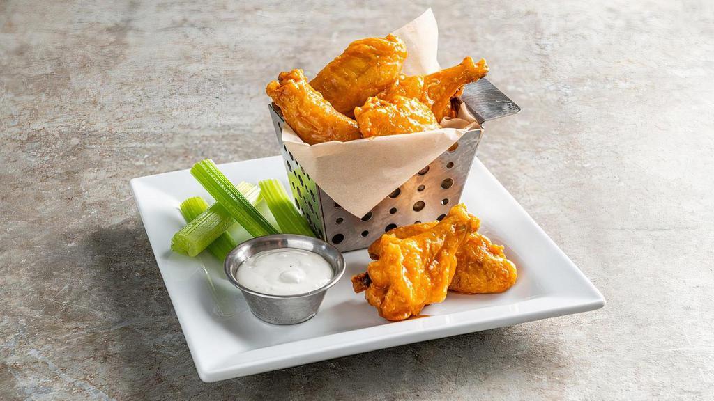 Bone-In Wings · Hand-tossed in choice of sauce, celery, dipping sauce.