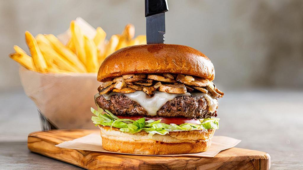 Mushroom Swiss Burger* · There’s so mush-room in our hearts for this one. Topped with sauteed onions, mushrooms, Swiss, lettuce, tomato & garlic aioli.