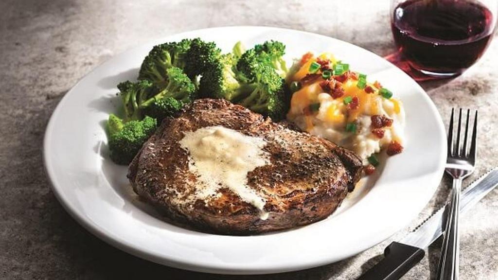 Classic Ribeye* · Marbled, thick-cut steak topped with garlic butter. Served with loaded mashed potatoes, steamed broccoli.