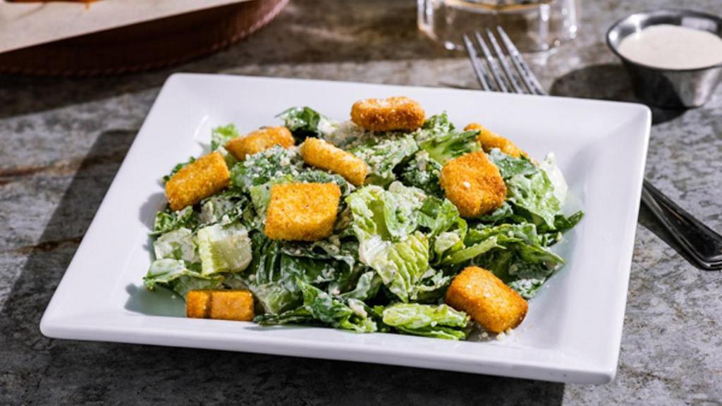 Side Caesar Salad · Romaine, Parmesan, croutons & Caesar dressing.