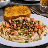 Cajun Chicken Pasta · Grilled chicken, penne in Alfredo sauce, topped with chile spices, Parmesan, tomatoes, green...