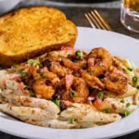 Cajun Shrimp Pasta · Shrimp, penne in Alfredo sauce, topped with chile spices, Parmesan, tomatoes, green onions. ...