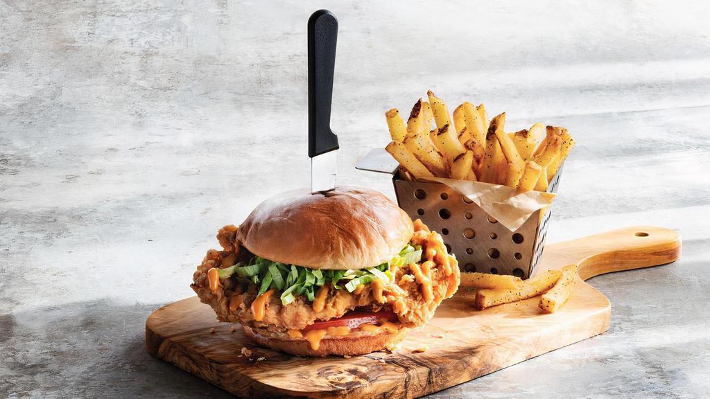 Big Mouth Crispy Chicken Sandwich · Hand-breaded crispy chicken, lettuce, tomato and our secret sauce on a brioche bun. Curious about our secret sauce? Get it on the side. You’re going to want to put it on everything.