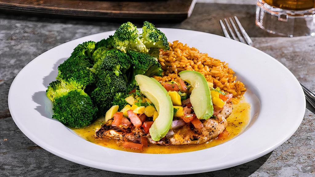 Mango-Chile Chicken · Chile spices, mango glaze & topped with chopped mango, cilantro, pico, avocado. Served with Mexican rice, steamed broccoli.