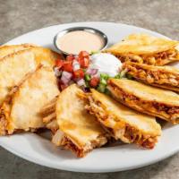 Bacon Ranch Chicken Quesadillas · Chicken, shredded cheese, chile spices, bacon, house-made ranch. Served with pico, sour crea...