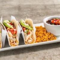 Ranchero Chicken Tacos · Three tacos in flour tortillas with pico, avocado, mixed cheese, jalapeño aioli, cilantro, q...