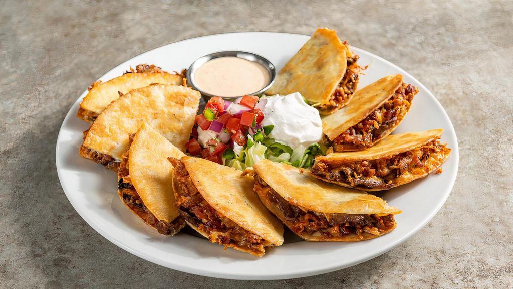 Beef Bacon Ranch Quesadillas · Steak, shredded cheese, chile spices, bacon, house-made ranch. Served with pico, sour cream, ancho-chile ranch.