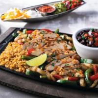 Lunch Chicken Fajitas · Sizzling with chipotle butter, cilantro, bell peppers & onions. Served with Mexican rice, bl...
