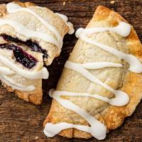 Blueberry Lemon Hand Pie · Flaky pie crust with blueberry filling, a touch of lemon zest and tart lemon frosting to top...