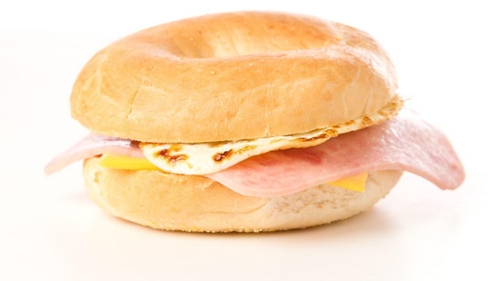 Ham, Eggs & Cheese Breakfast Bagel · Sliced ham, cheese and two eggs garnished on a delectable bagel.