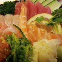 Chirashi Sushi · Undercooked. An assortment of sashimi over sushi rice.