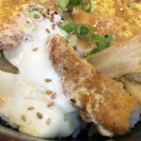 Katsu Donburi · Deep fried breaded pork loin, veg and egg over rice.