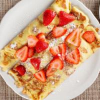 French Crepe · Rolled with fresh strawberries and served with warm strawberry syrup and powdered sugar.
