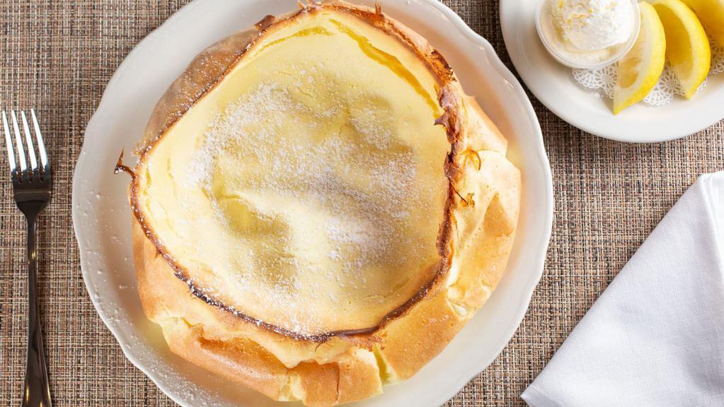 Dutch Baby · Our truly unique oven-baked, egg-based soufflé. Garnished with a lemon glaze made with fresh lemons, whipped butter, and powdered sugar prepared at the table. 840 cal.