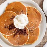 Chocolate Chip Pancakes · Buttermilk pancakes filled and topped with Hershey’s® mini chocolate chips. Lightly dusted w...