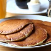 Buttermilk Pancakes · Golden pancakes served with whipped butter and syrup.