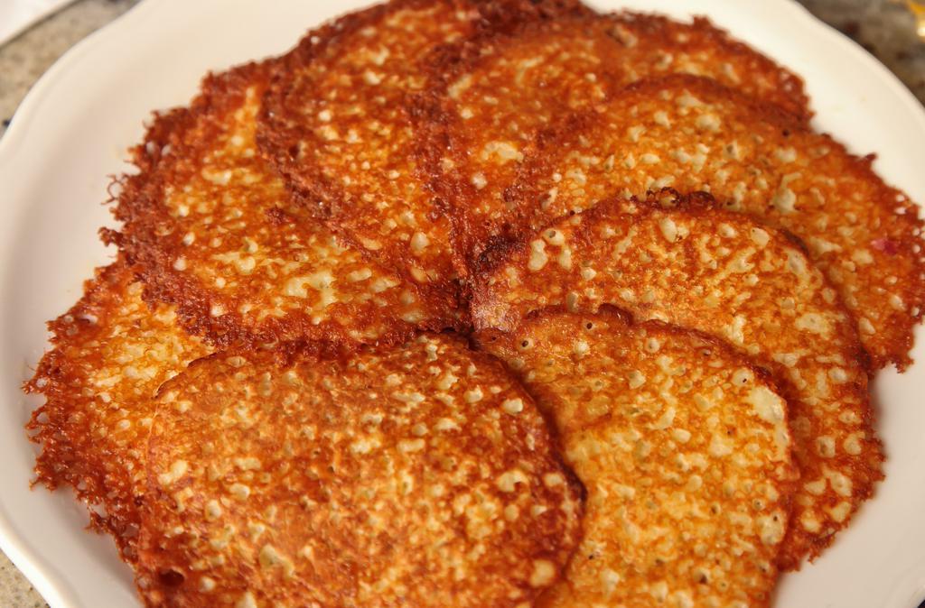 Potato Pancakes · Delicious potato pancakes served with sour cream or cinnamon applesauce. (cooked with peanut oil).
