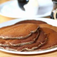 Buckwheat Pancakes · Straight from the mill, yeasty old fashioned pancakes, served with whipped butter and hot ma...