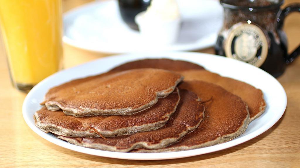 Buckwheat Pancakes · Straight from the mill, yeasty old fashioned pancakes, served with whipped butter and hot maple syrup. (cooked with peanut oil).
