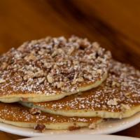 Georgia Pecan Pancakes · Filled and topped with GA pecans and dusted with powdered sugar. Served with a side of tropi...