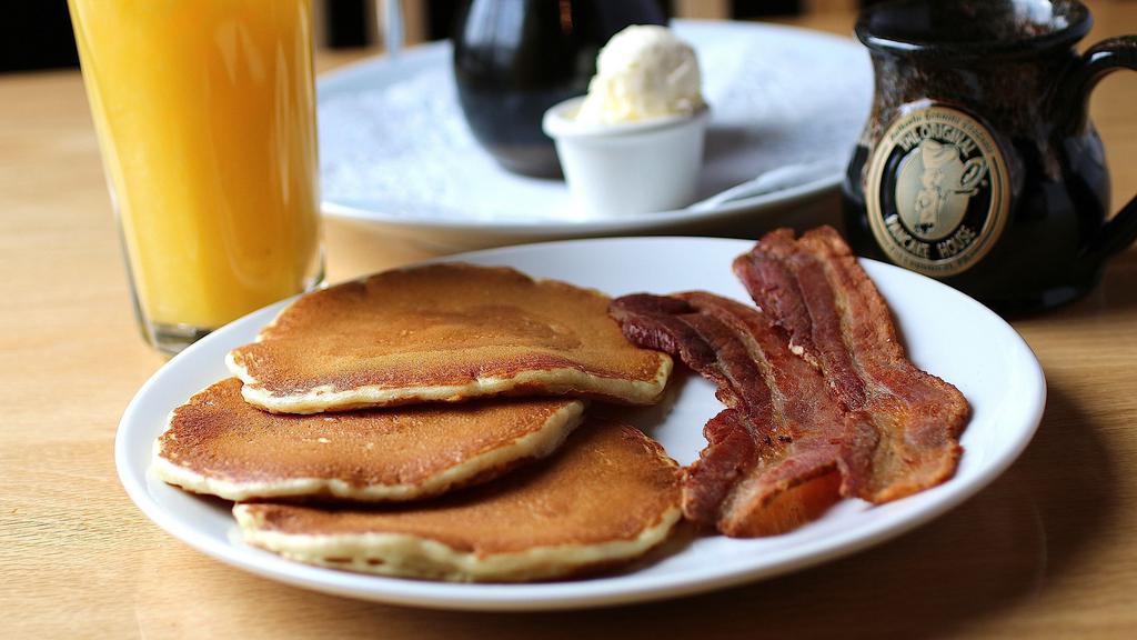 Junior Plate · Favorite for children under 12. Three buttermilk pancakes with a choice of bacon, link, patty sausage or one egg any style, served with whipped butter and syrup. (cooked with peanut oil).