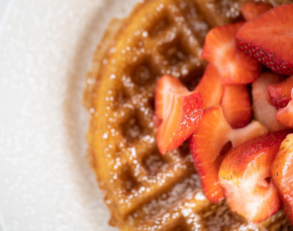 Strawberry Waffle · Our waffle lightly dusted with powdered sugar and topped with fresh strawberries. Served with warm strawberry syrup and real whipped cream made fresh with pure vanilla. 850 cal.