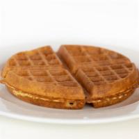 Plain Waffle · Golden brown waffle, served with whipped butter and hot maple syrup.